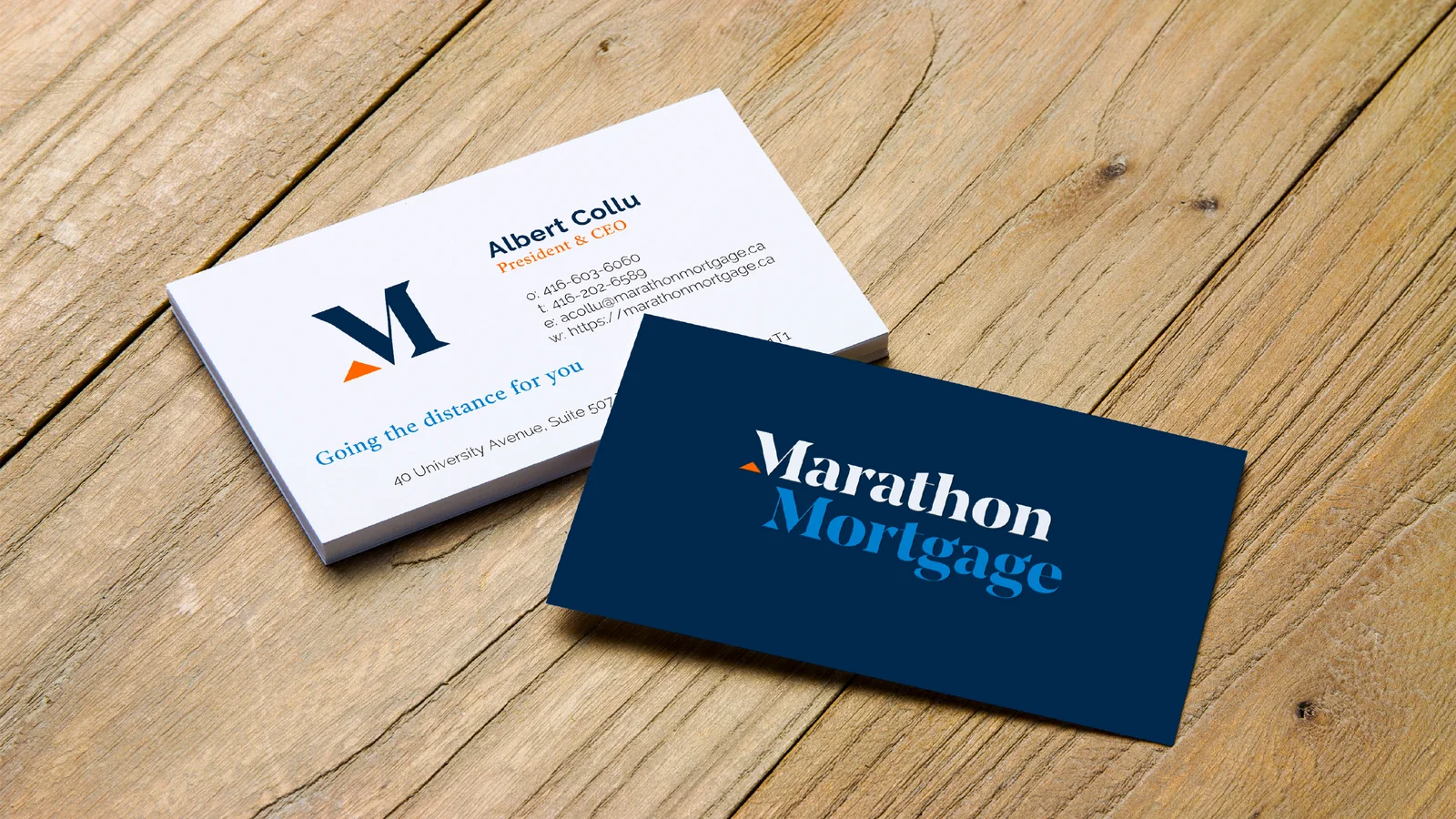 Marathon Mortgage business cards on a wood surface